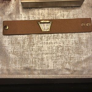 Bronze colored leather band with gold cut out